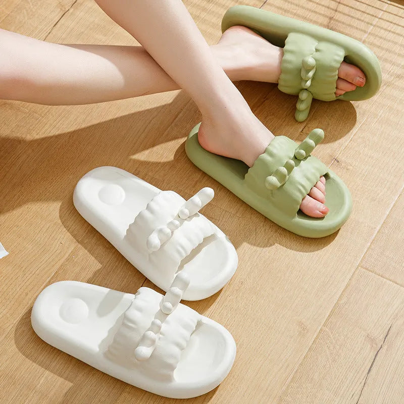 Women's light yellow EVA flip flop slippers with deer horn design and hollow-out upper on a plain background.