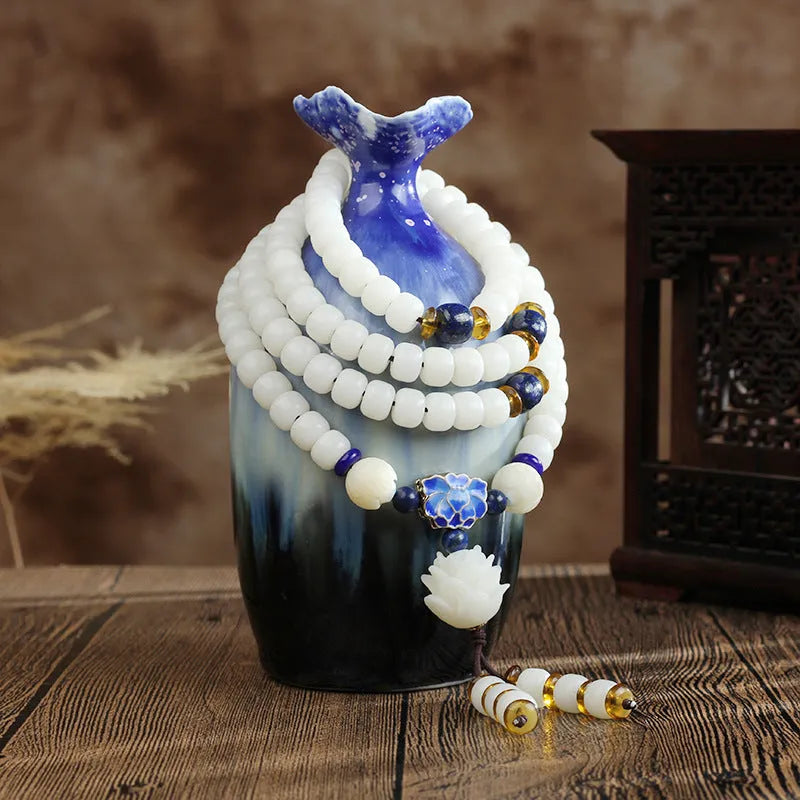 White jade bodhi beads long bracelet with 6x8mm beads in a decorative style
