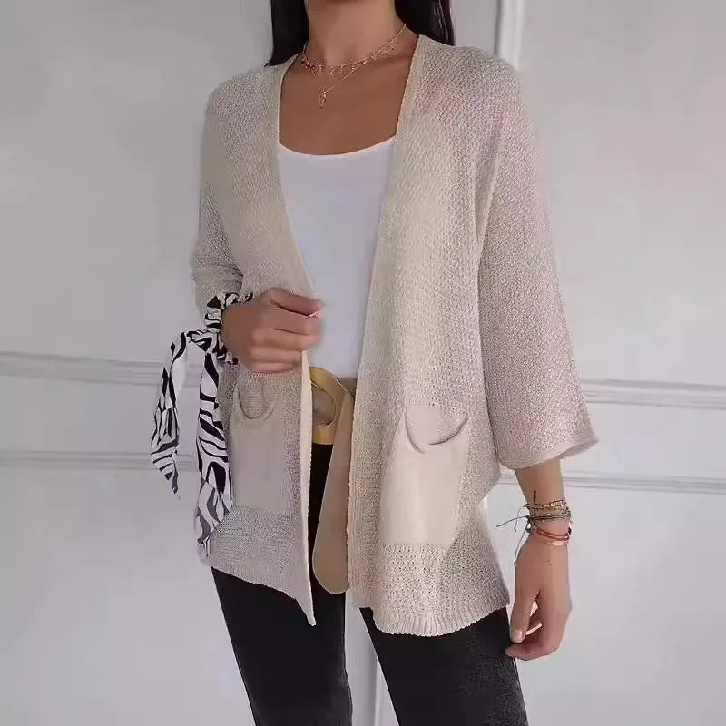 Women's waffle-textured cardigan coat in army green with nine-quarter sleeves and pockets.