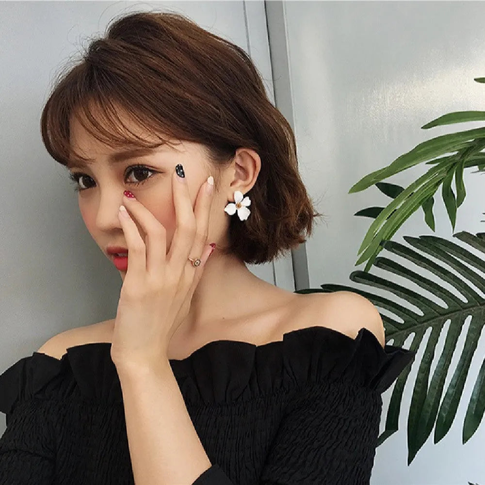 Flower-shaped stud earrings for women in pink or white colour with electroplated alloy construction