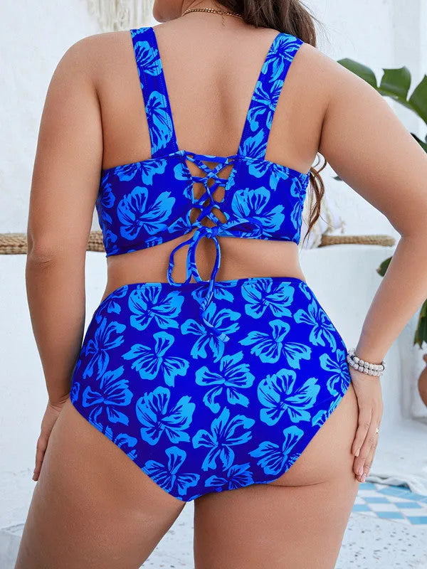 Blue floral print women's plus size two-piece bikini swimsuit on a hanger.