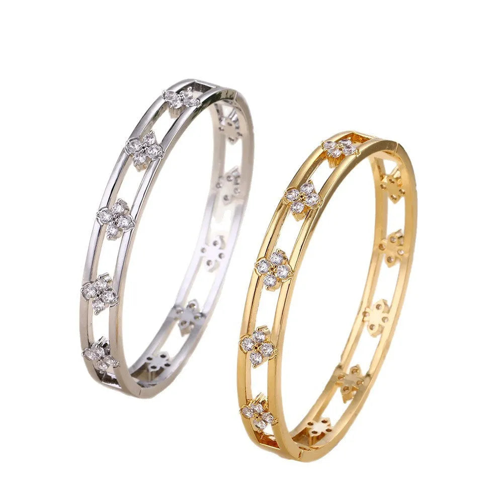 Women's hollow bracelet with zircon stones and four-leaf clover design