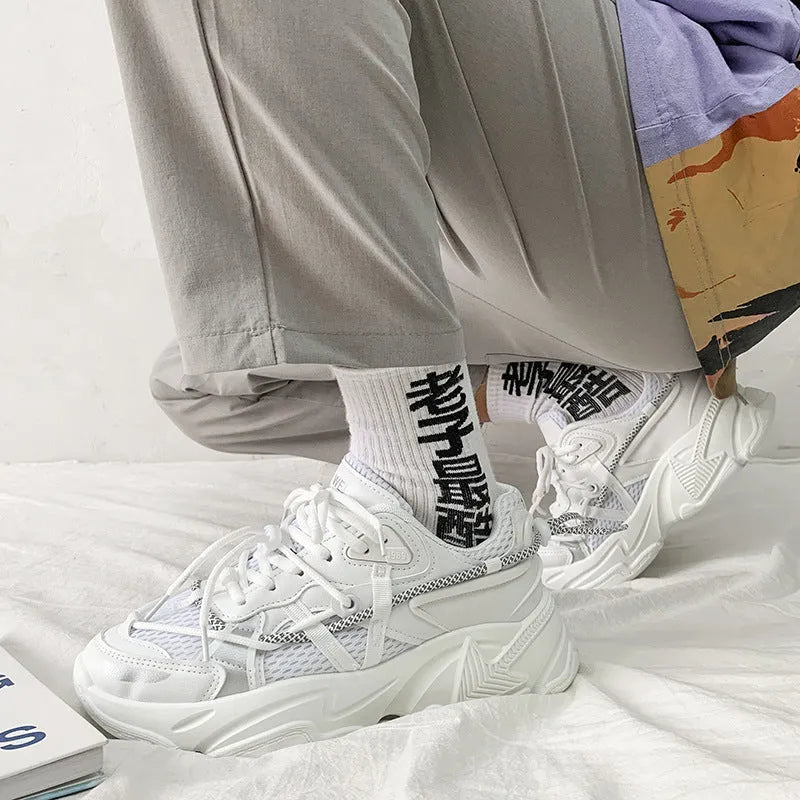 Men's white platform dad shoes with front lace-up, shown on a neutral background.