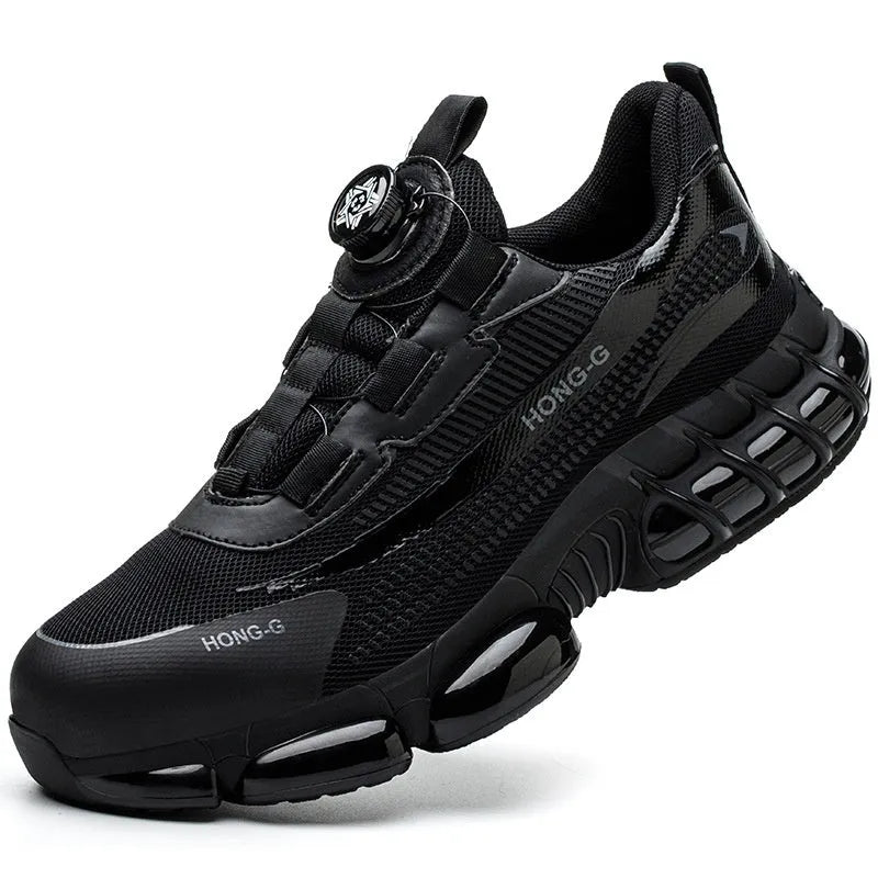 Lightweight black safety work shoes with a steel toe cap and breathable flyweave upper on a work floor.