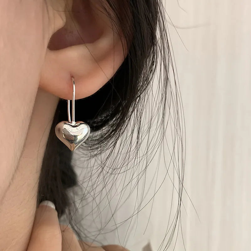 Three-dimensional glossy heart earrings with Korean style silver tone finish