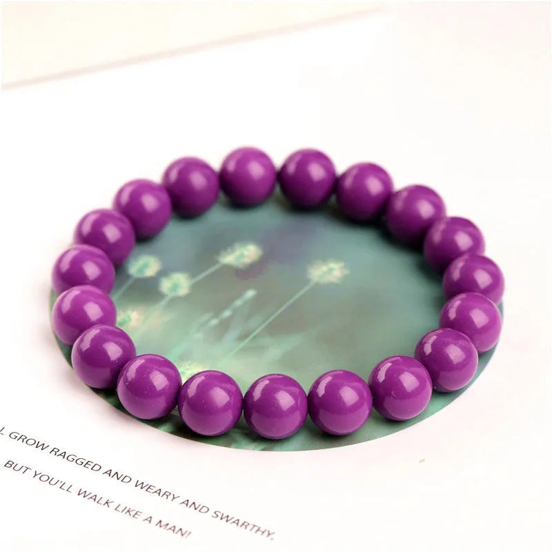 Jiuya polished purple mica crystal bracelet shown in single circle design on a wrist.