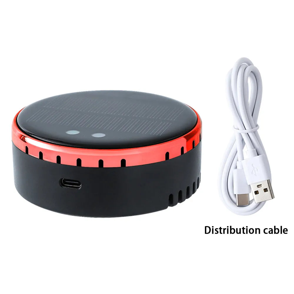 A black solar-powered car air humidifier mounted on a vehicle's air conditioning vent.