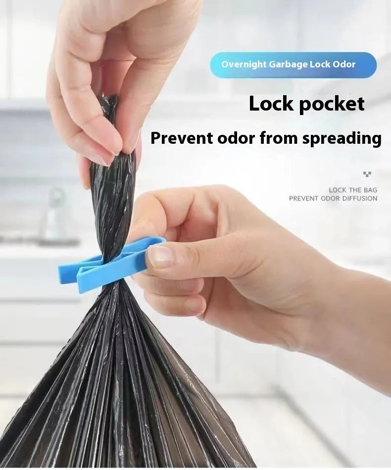 A white polypropylene garbage bag fixing clip holding a black bin liner to the rim of a metal trash can.