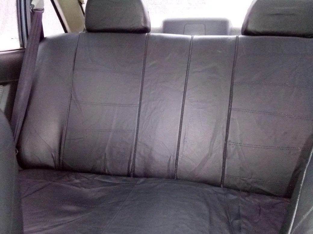 Car leather seat cover set 9-piece with installation hooks and English manual on vehicle seat