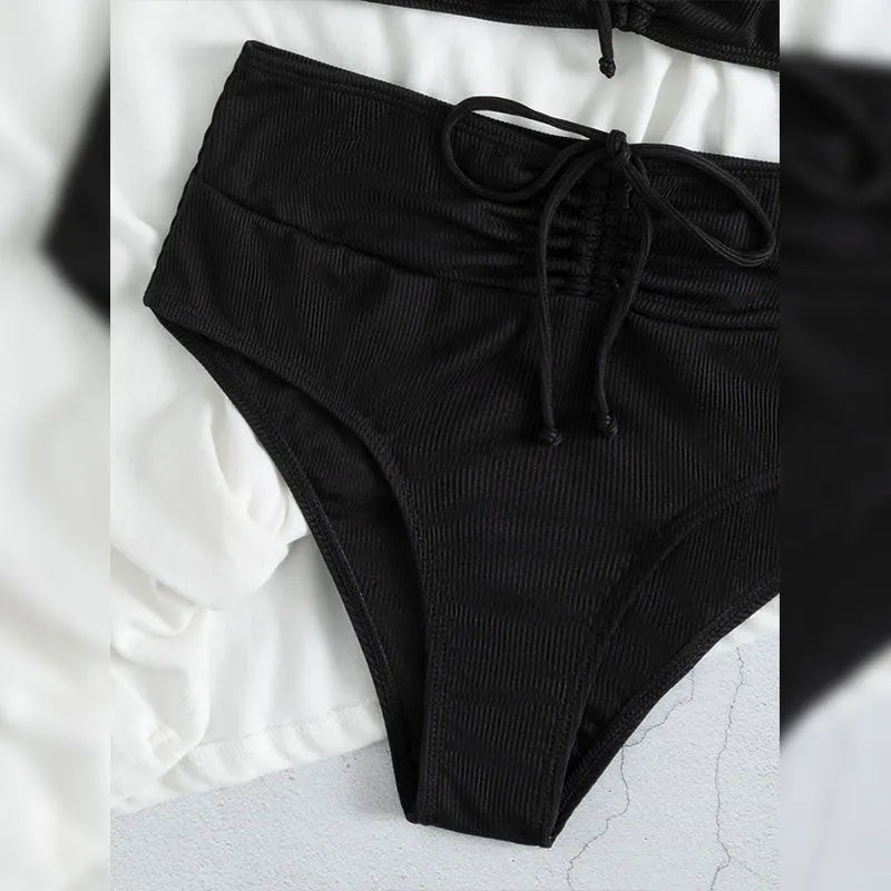Women's black nylon sling split high waist bikini swimsuit set with top and shorts