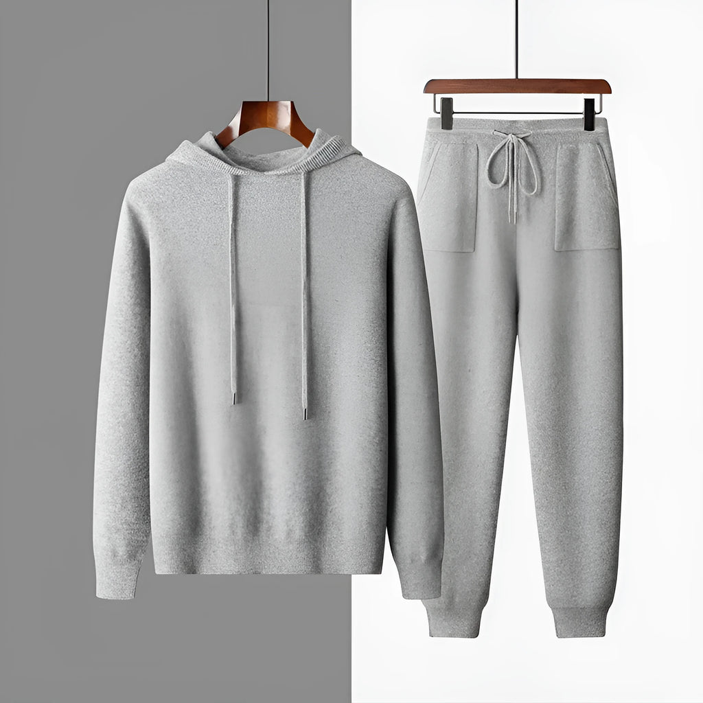 Men's light gray cashmere hooded sweatshirt and matching track pants laid flat.