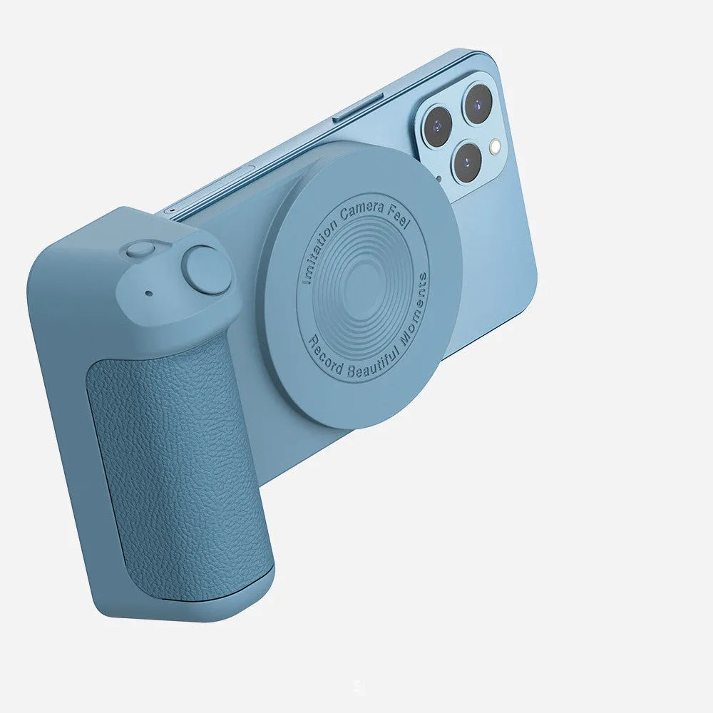 Black 3-in-1 magnetic phone camera holder with ergonomic handle on a wooden table.