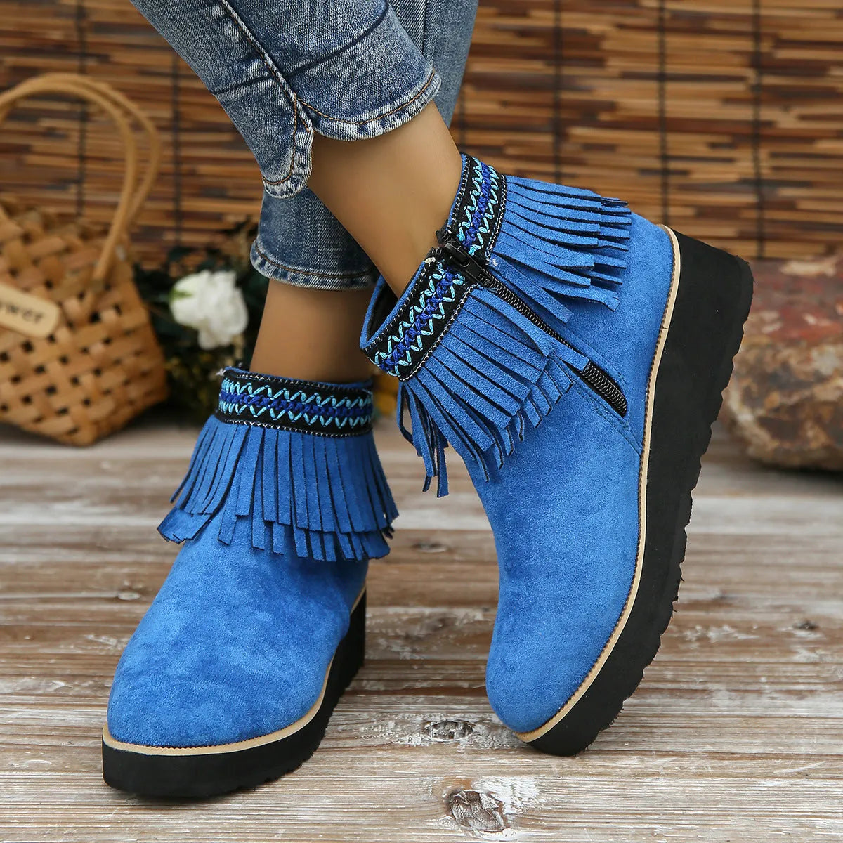 Women's black suede wedge ankle boots with tassel and side zip on a waterproof platform sole.