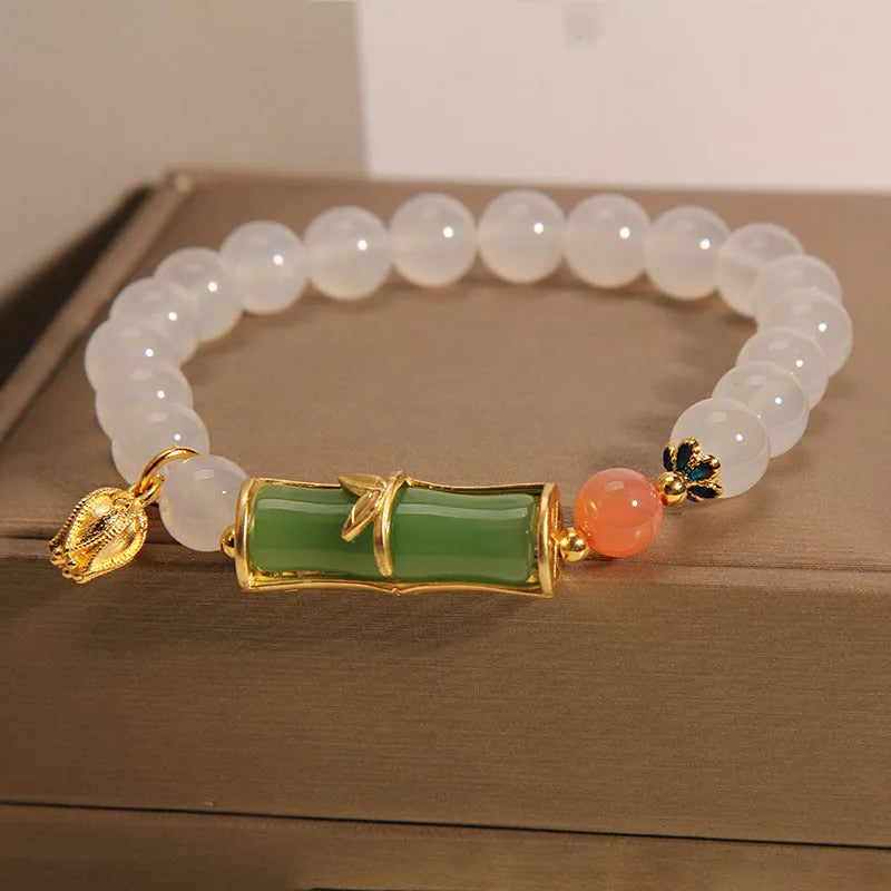 White agate and jade bamboo beaded bracelet on wrist, natural stone jewellery for women
