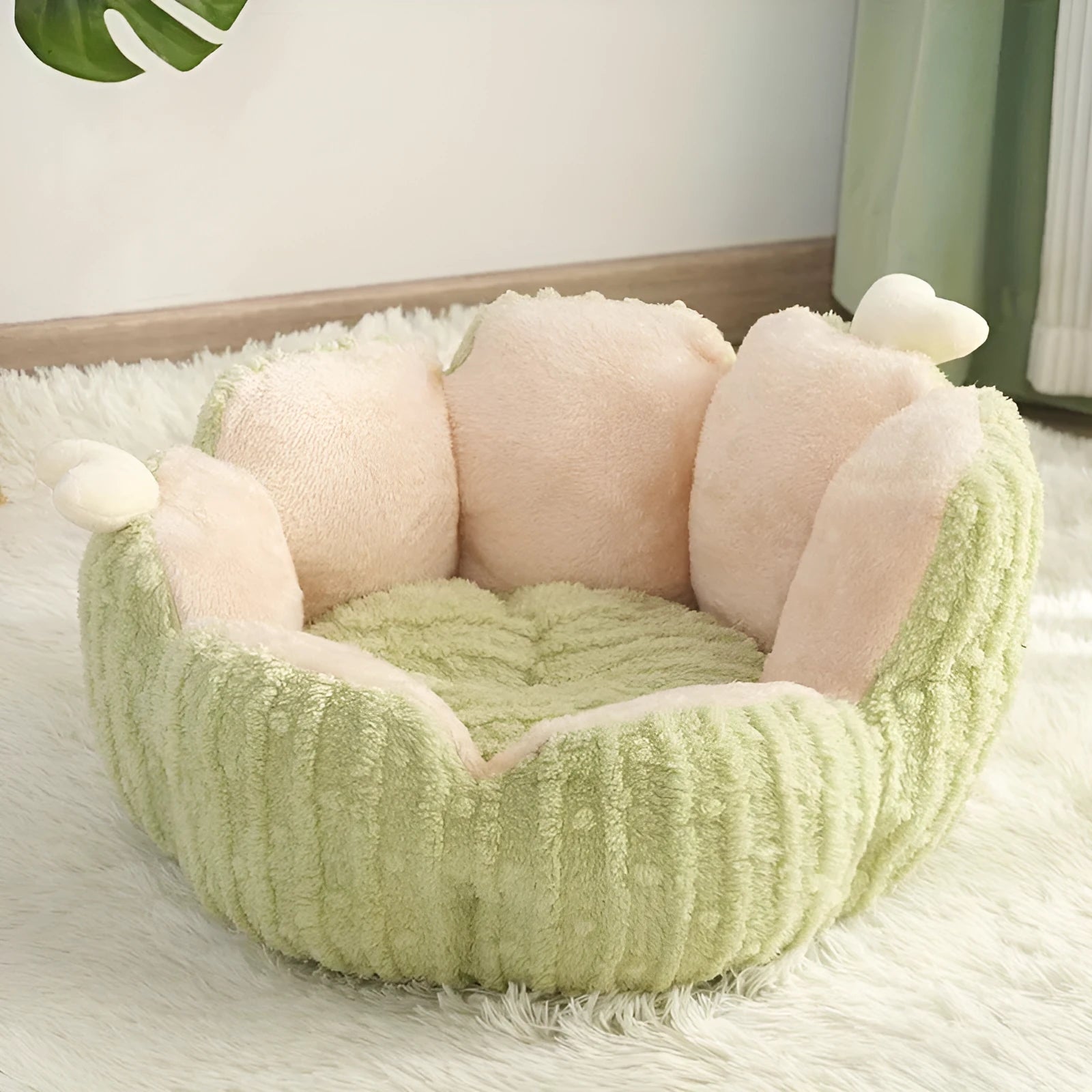Soft green cactus-shaped cat litter kennel for dogs and cats on a floor.