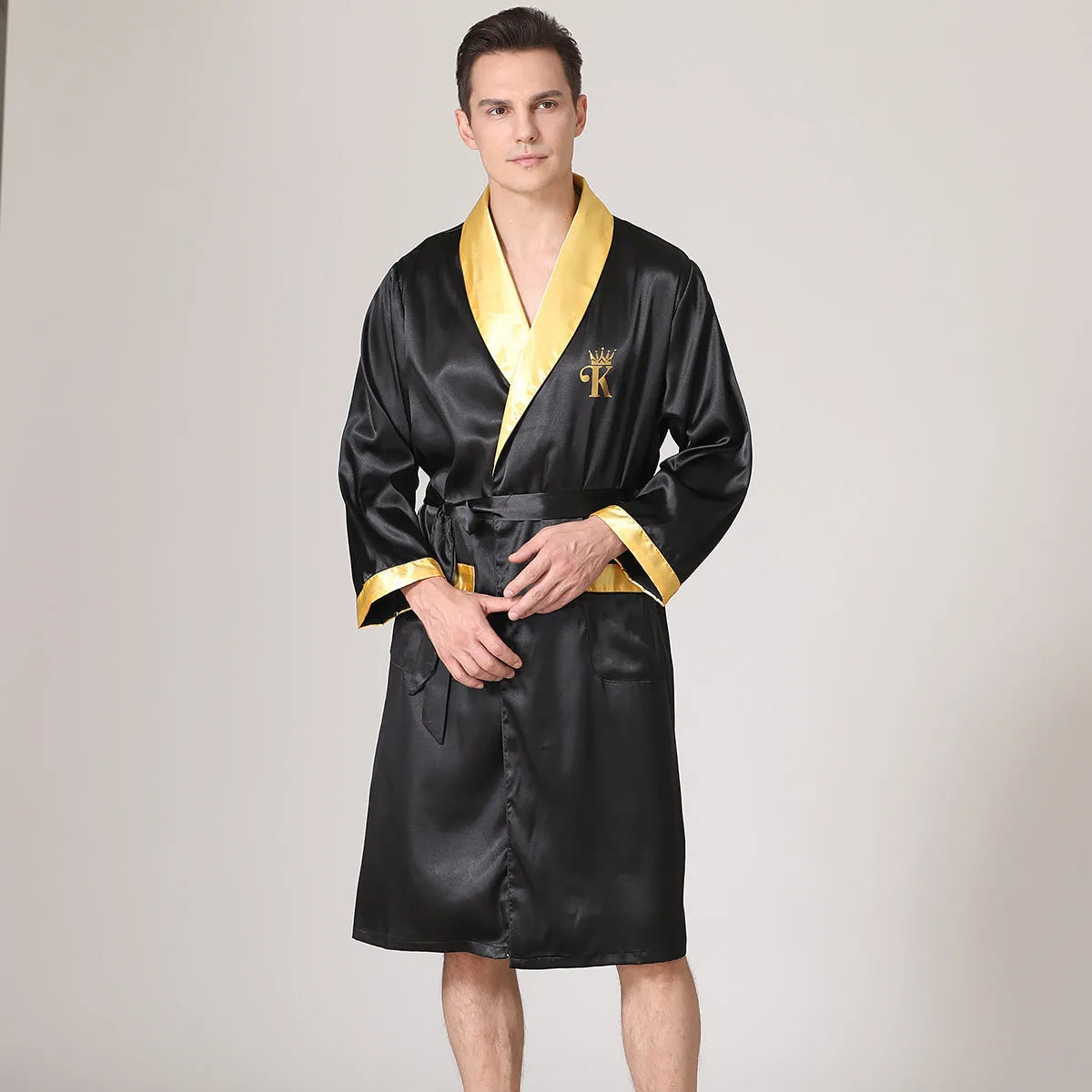 Man in a lightweight grey striped silk bathrobe for summer home lounging.