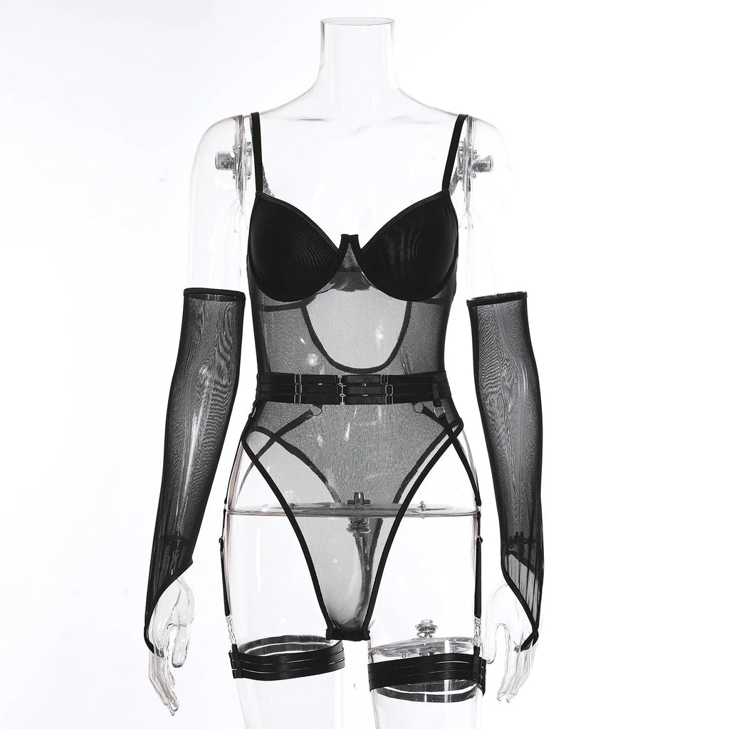 A woman wearing a black see-through mesh jumpsuit, showing the clingy fit and transparent fabric.