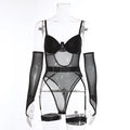 A woman wearing a black see-through mesh jumpsuit, showing the clingy fit and transparent fabric.