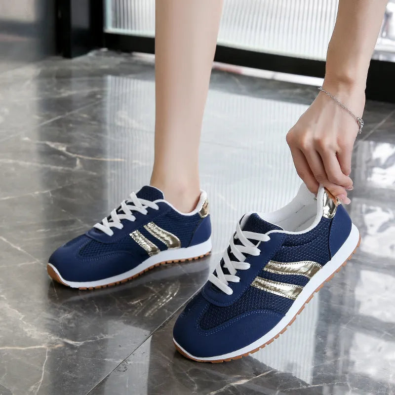 Blue women's casual tennis shoes with cross shoulder straps, round toe, and non-slip rubber soles