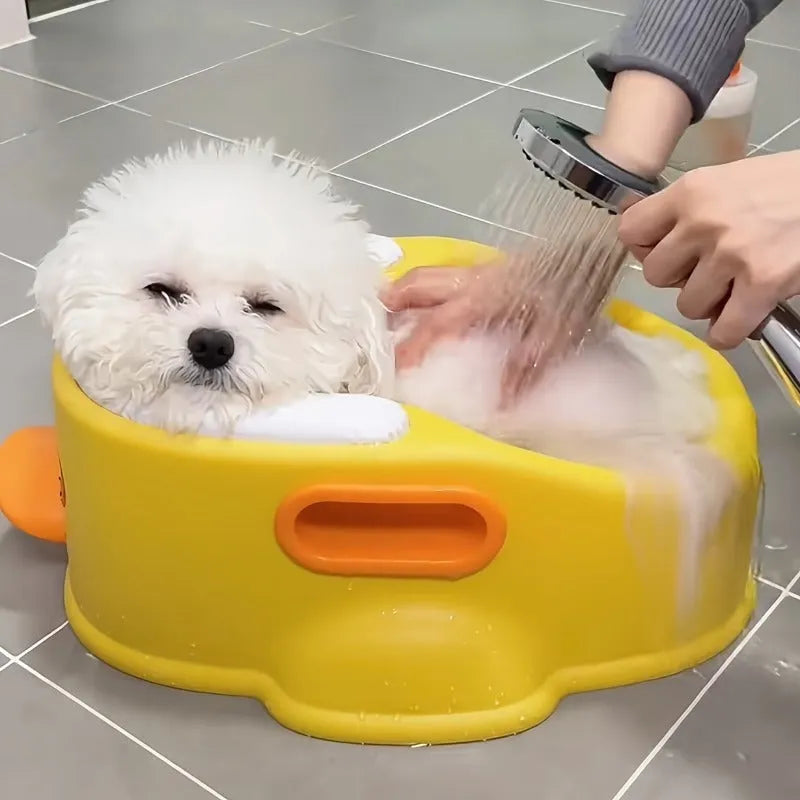 Blue duck-shaped PVC bathtub for washing a small dog or cat.