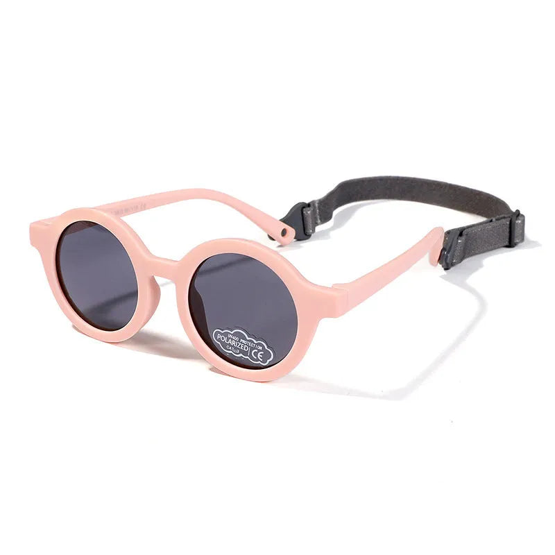 Round frame polarised sunglasses for toddlers aged 0-3 years with UV400 protection, shown in multiple colour options.