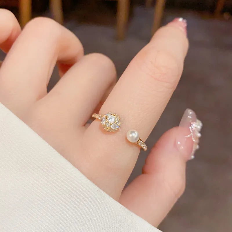 Adjustable open-end ring with round zircon pearl design in gold and silver colours