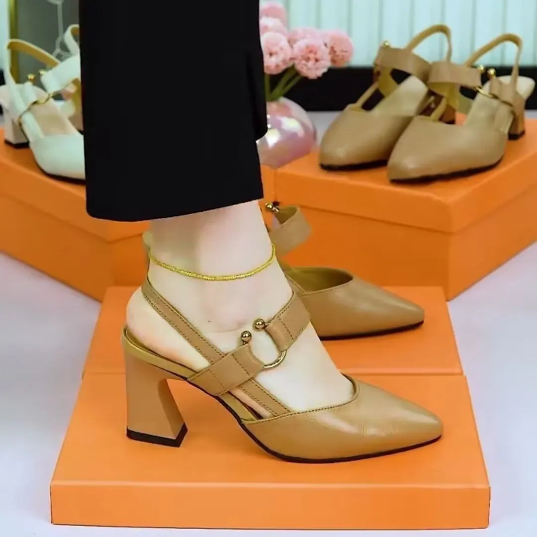 Women's closed toe backless leather sandals with a chunky heel and oversleeve strap in apricot colour.