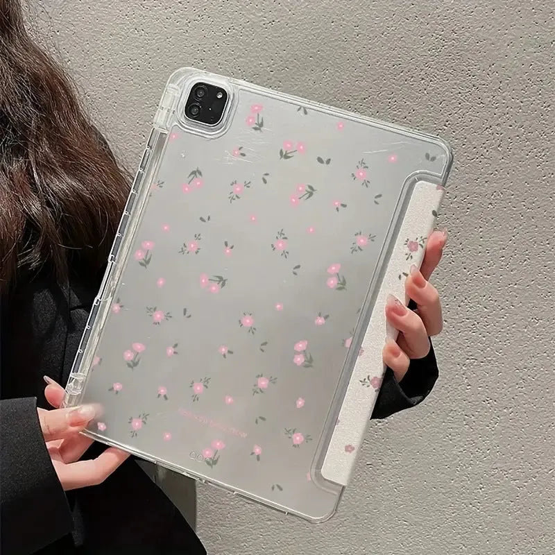 Transparent floral tri-fold hard case for iPad showing magnetic closure and stylus loop.