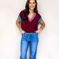 Burgundy loose sweater with contrast trim, V-neck and cuffed short sleeves