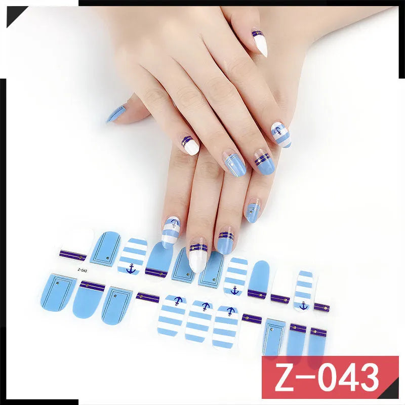 Korean nail stickers set with 22 pieces and nail file, showing cartoon, strawberry, flower, and embossed water drop patterns on nails