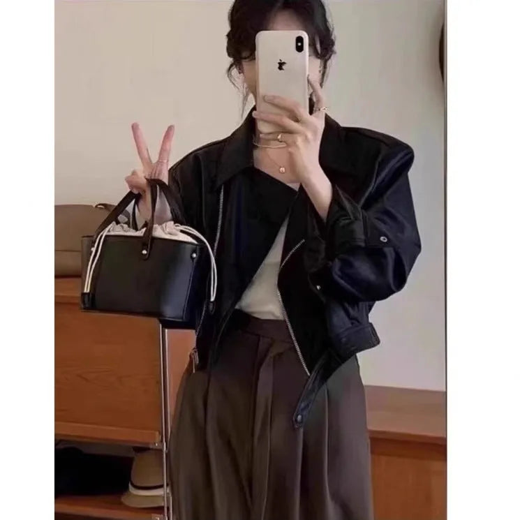 Women's brown retro imitation leather jacket with long sleeves and pocket details, slim fit.
