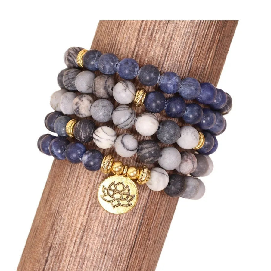 Multi-layer alloy women's bracelet with blue patterned network stone beads.