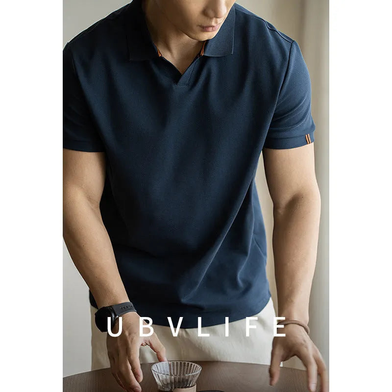 Blue cotton blend polo shirt with short sleeves displayed front view