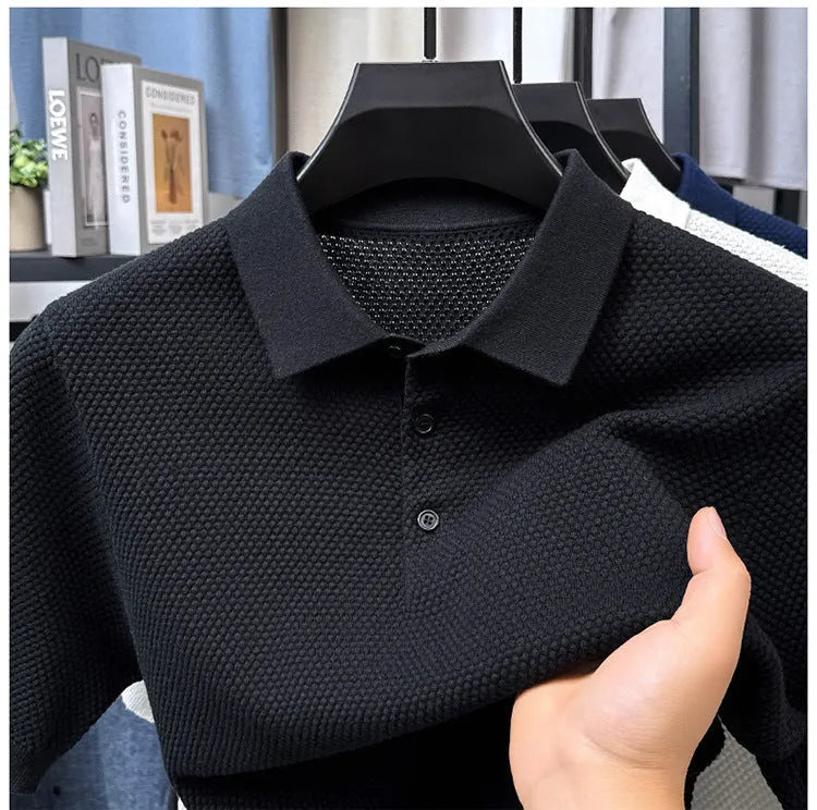 Man wearing a loose grey cotton short sleeve pullover sweater for casual leisure.
