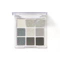 Smoked nine-colour eyeshadow palette showing shades including white, silver, black, and iron grey
