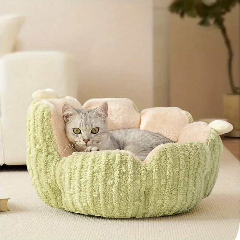 Soft green cactus-shaped cat litter kennel for dogs and cats on a floor.