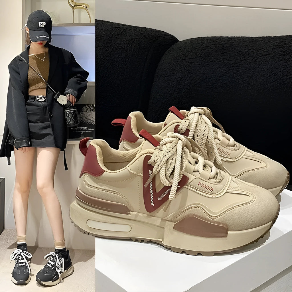 Retro platform sports shoes in black with round toe, front lace-up, rubber sole, and mesh lining