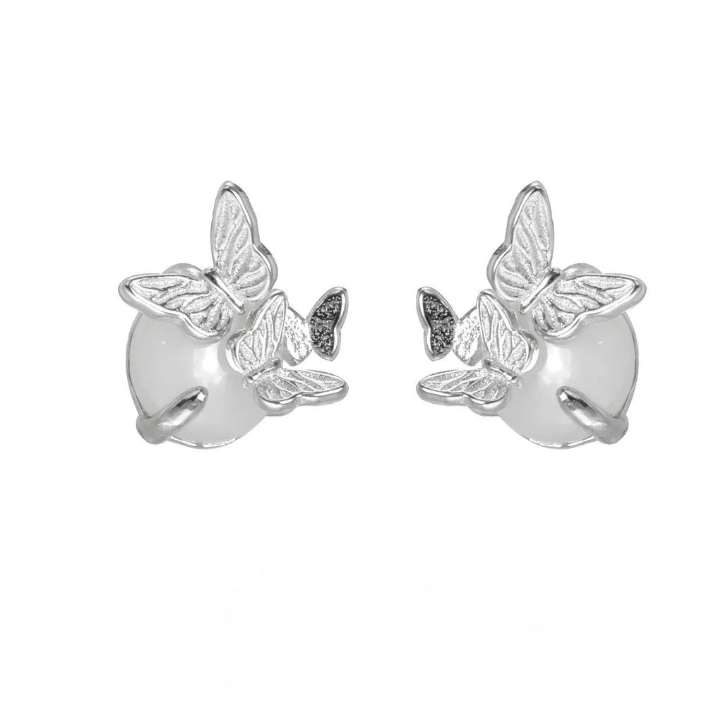 Butterfly ear studs in 925 silver with electroplated gold or white gold finish featuring zodiac modelling