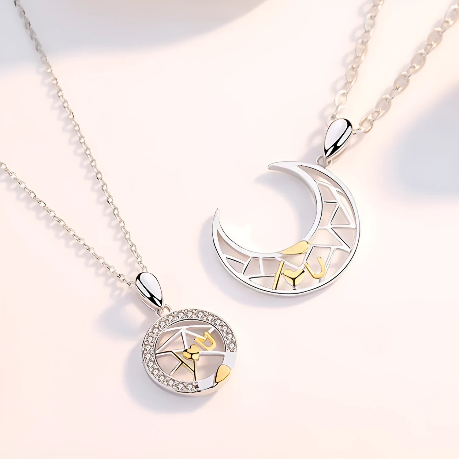 Copper sun and moon tooth couple necklace with electroplated finish on cross chain.