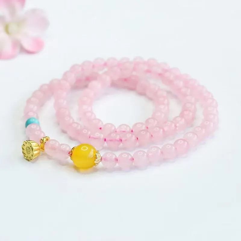 Pink artificial crystal multi-circle bracelet featuring classic Pi Xiu design on white background