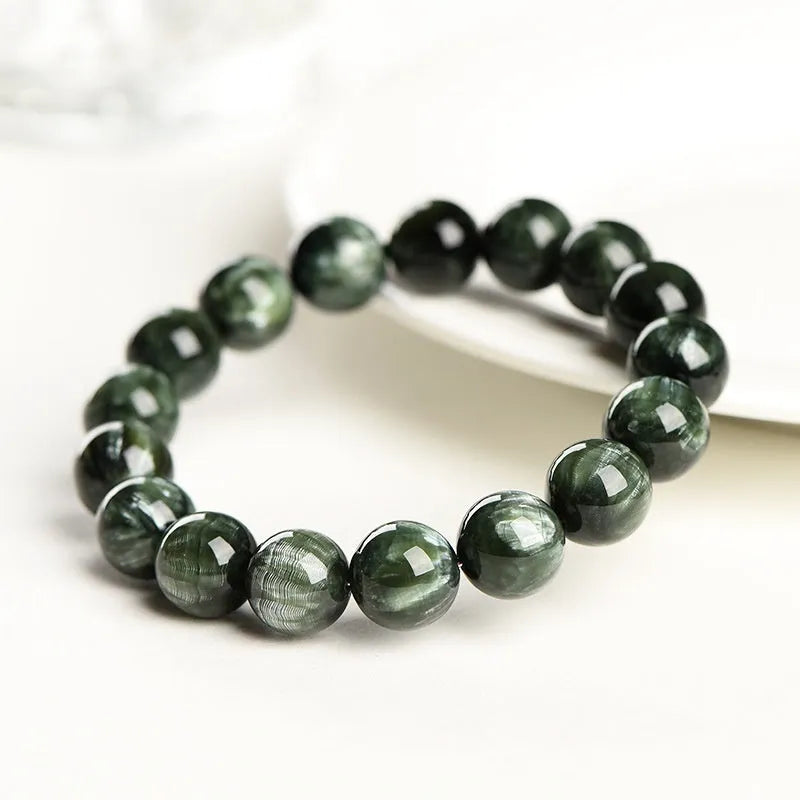 Green Dragon Crystal bracelet with round beads featuring Ruyi element design