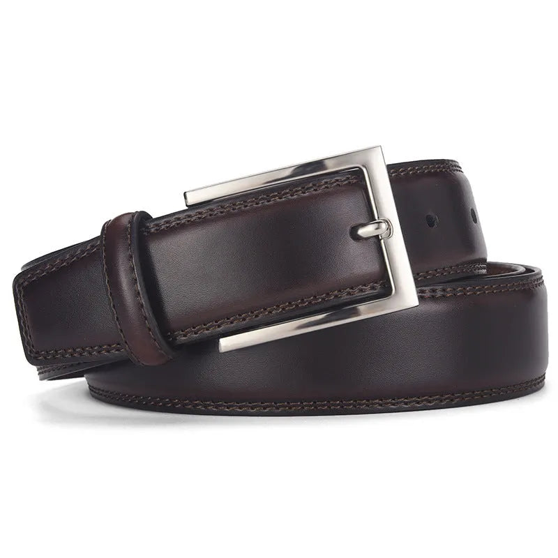 Men's black genuine leather belt with a silver alloy pin buckle on a trouser waistband