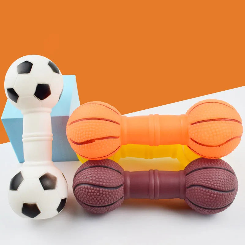 Colourful PVC football dumbbell shaped dog toy on a plain background.