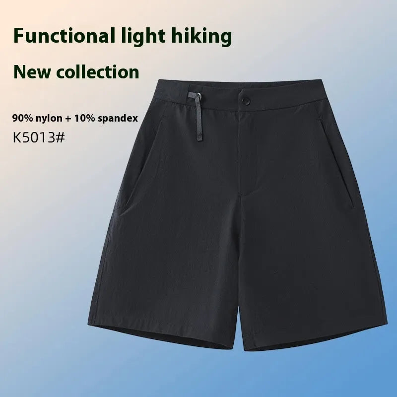 Men's solid colour quick-dry sports shorts with elastic waistband shown in Army Green