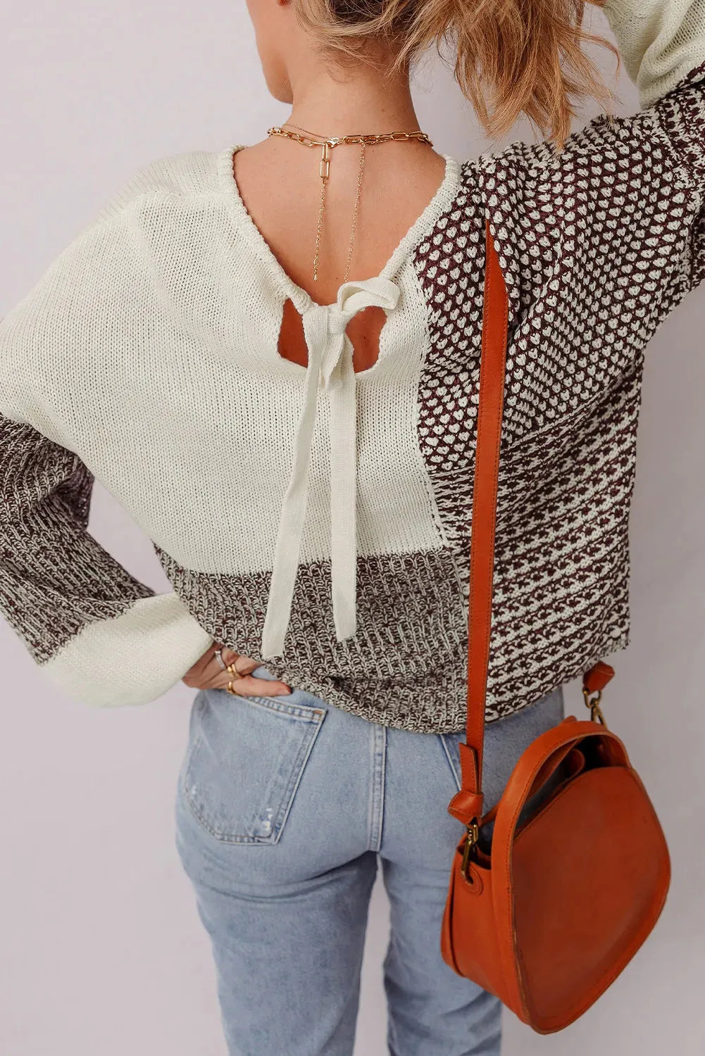 Dark khaki women's sweater with colour block design, drop shoulders, and a back tie.