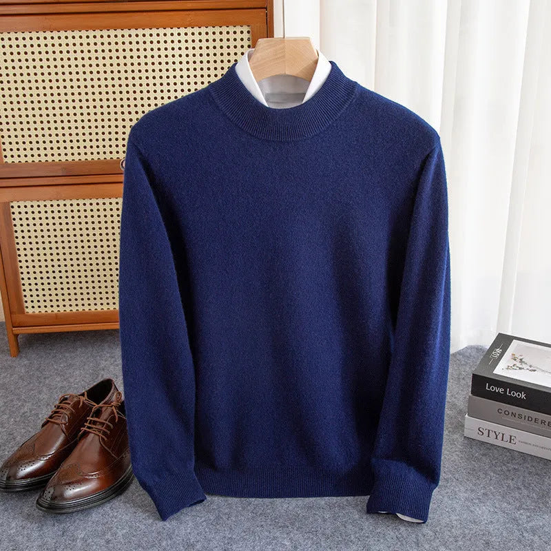 Man wearing a loose-fit half-collar wool sweater in a neutral colour, showing the knit texture and regular sleeve design.
