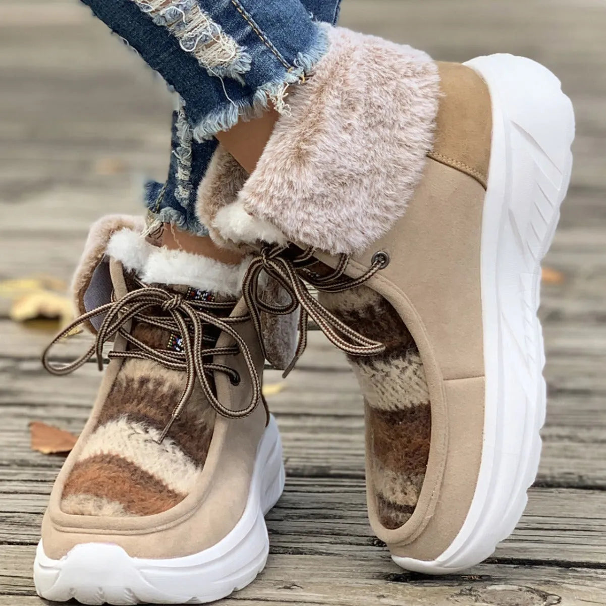 Beige women's lace-up suede snow boots with thermal lining and a thick rubber sole.