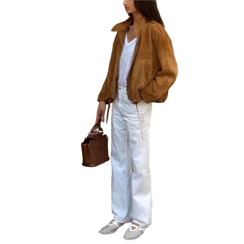 Loose-fit solid colour polyester jacket with long sleeves on a model.