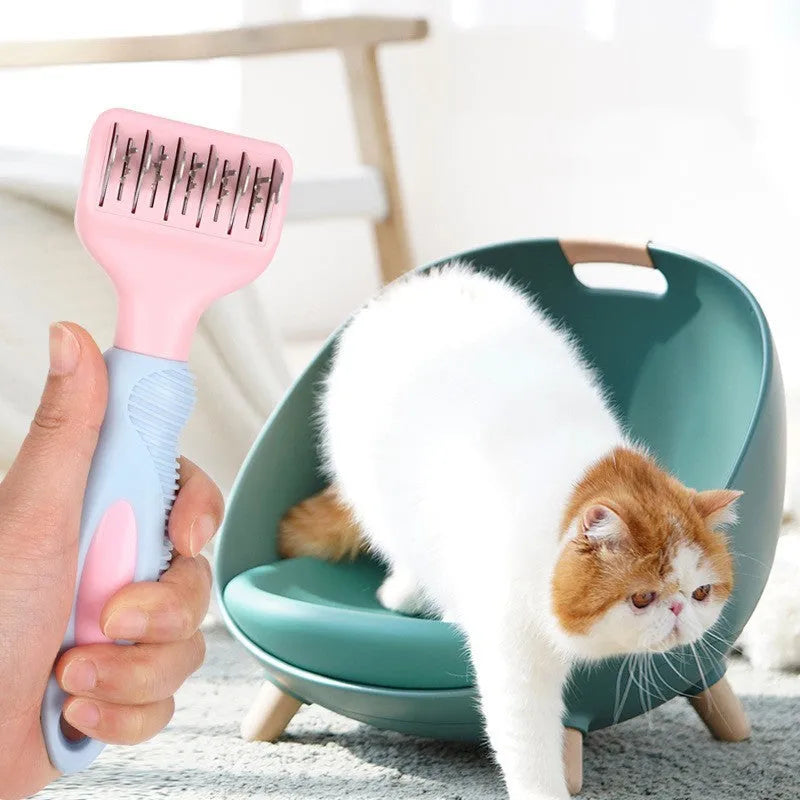 Pink stainless steel pet comb with integrated knot knife for grooming dogs and cats.