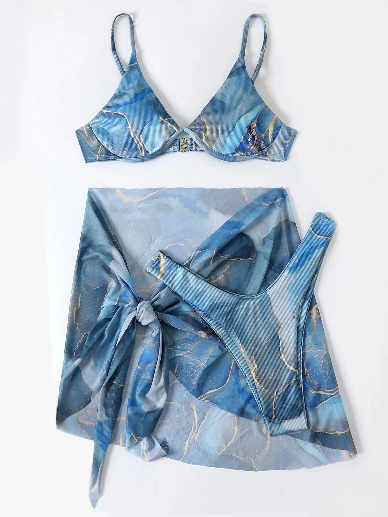 Women's marble print three-piece bikini swimwear set showing bra, panties, and skirt in blue colour
